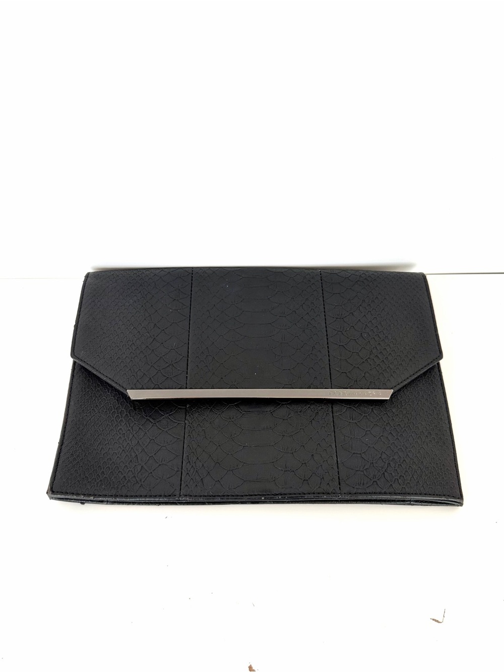 BCBGMaxAzria Black Textured Envelope Clutch with Silver Accent Bar